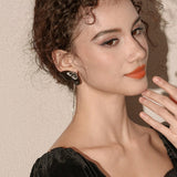 Noir Papillon Tassel Earrings